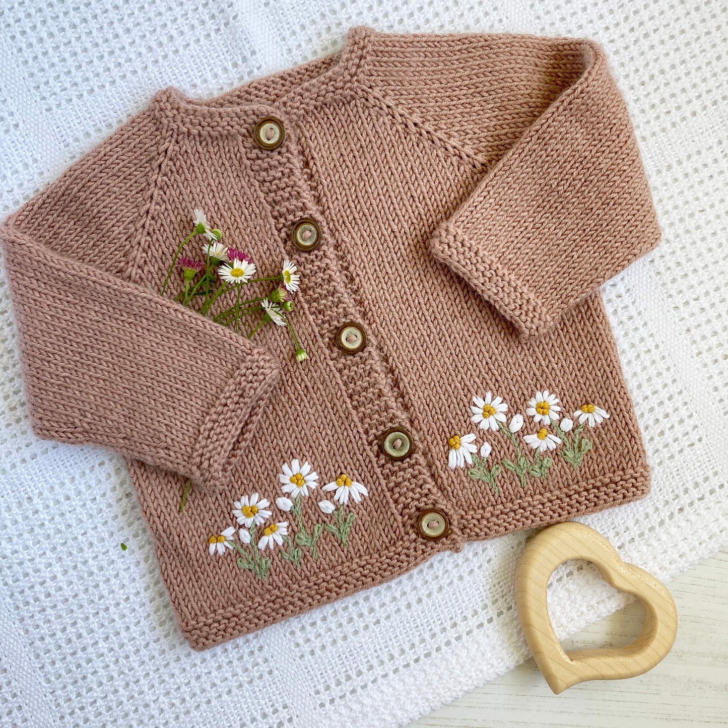 a pdf daisy embroidery pattern for baby cardigans