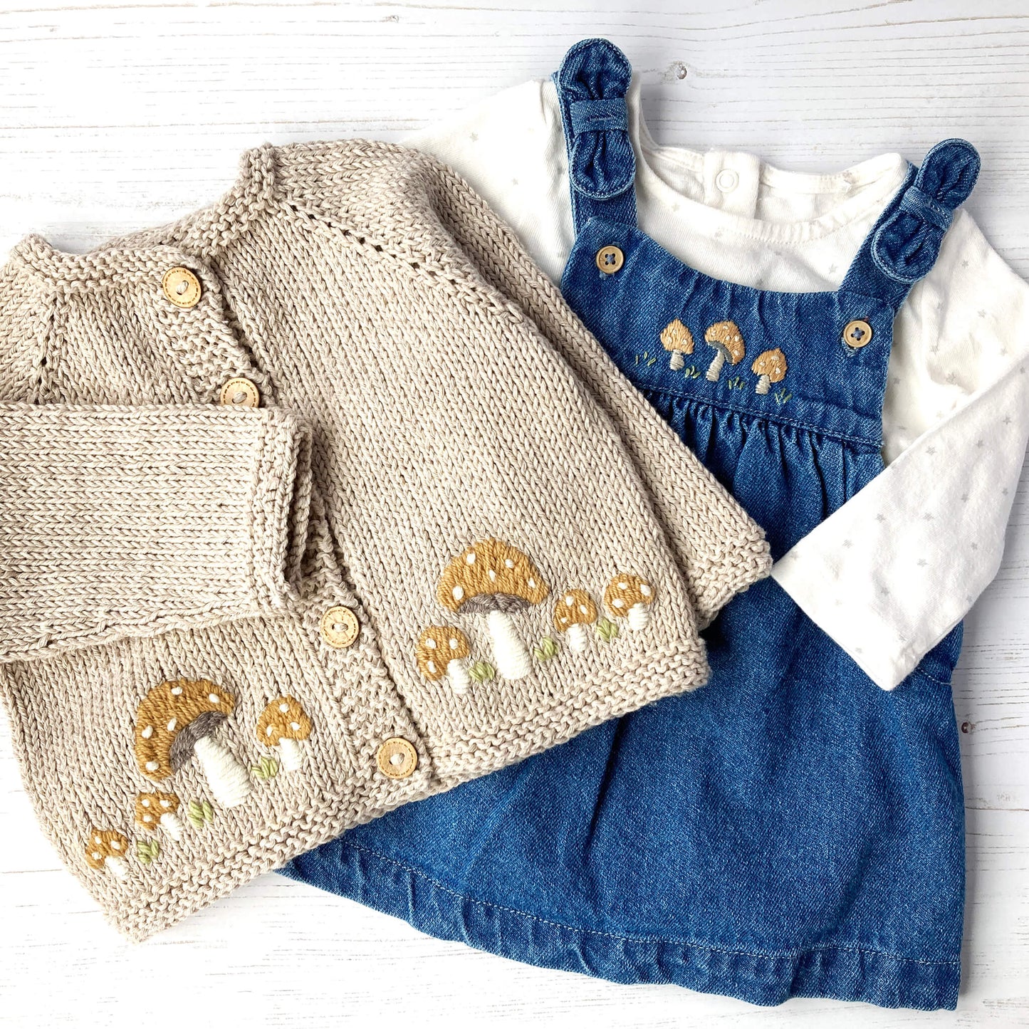 toadstool embroidery pdf for baby clothes. toadstool embroidery is shown on cardigan and pinafore dress