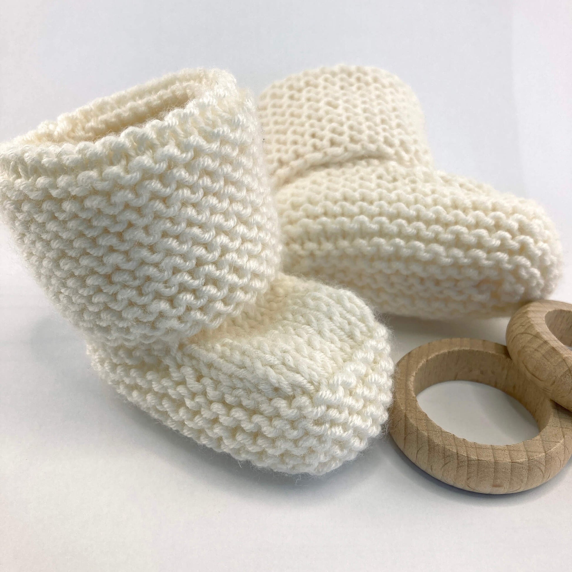 sample booties for an easy knit pattern. booties are knitted in white yarn