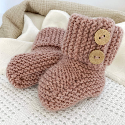 a baby booties knitting pattern with turn down garter stitch cuff and faux button opening