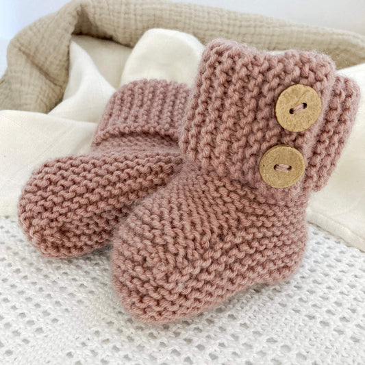 a baby booties knitting pattern with turn down garter stitch cuff and faux button opening