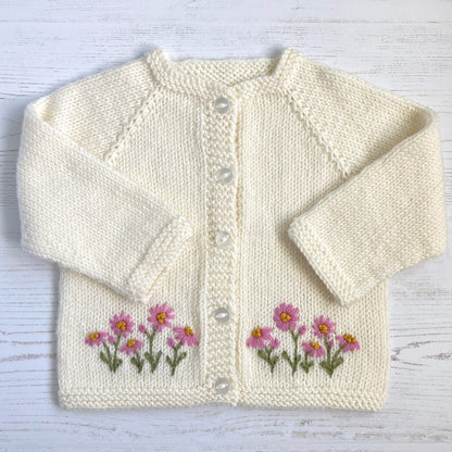 an embroidery pattern for baby clothing featuring a daisy design