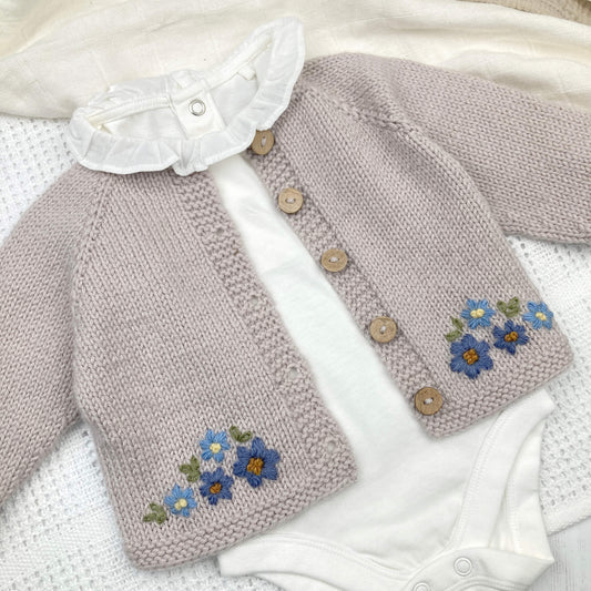  baby cardigan knitting pattern with floral patterns 