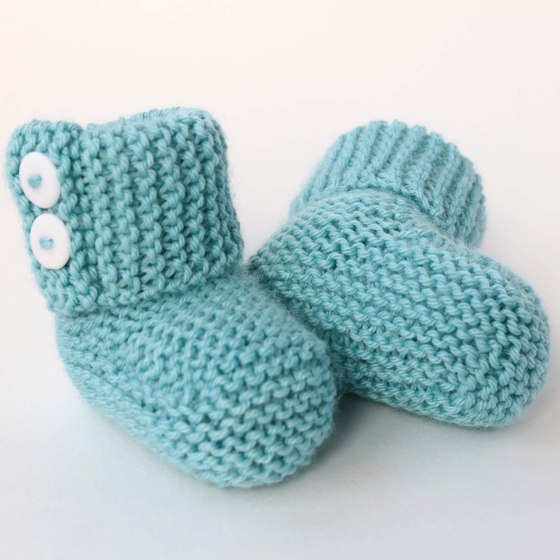 a knitting pattern for baby booties with fold over cuff and buttons