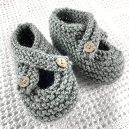 a knitting pattern for baby shoes with crossover starps